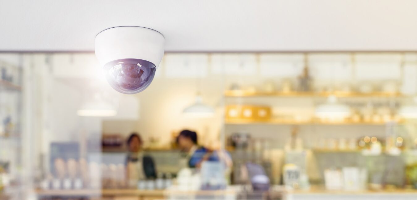 Dome camera mounted on the ceiling of a café